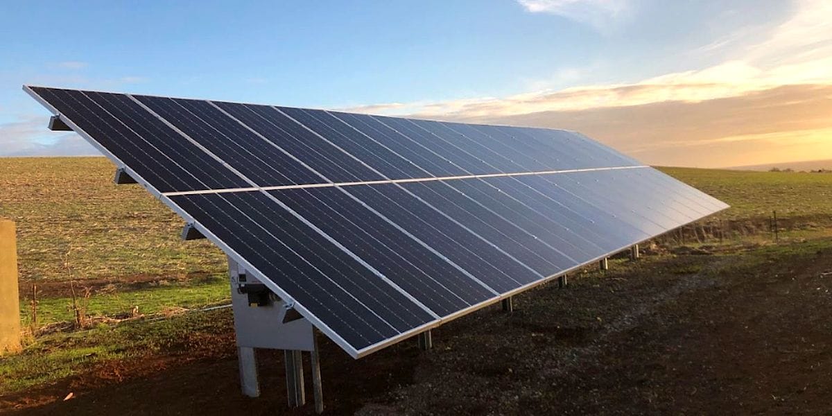 Ground mounted solar array being serviced